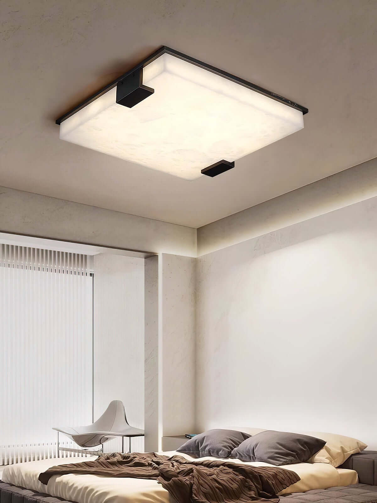 Modern Faylen ceiling light in alabaster flush mount design, enhancing a stylish bedroom with mid-century decor.