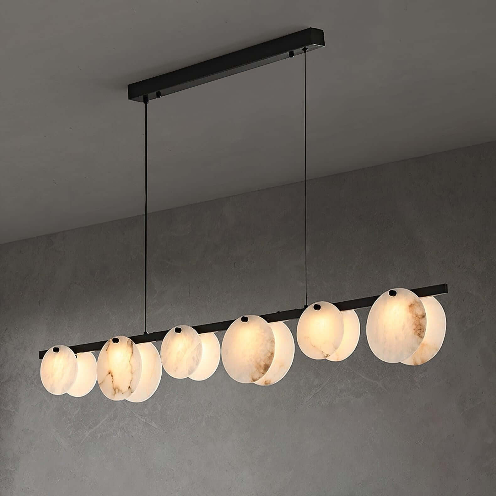 Frumix linear chandelier with alabaster shades, mid-century modern design, showcasing 6 lights against a gray wall.