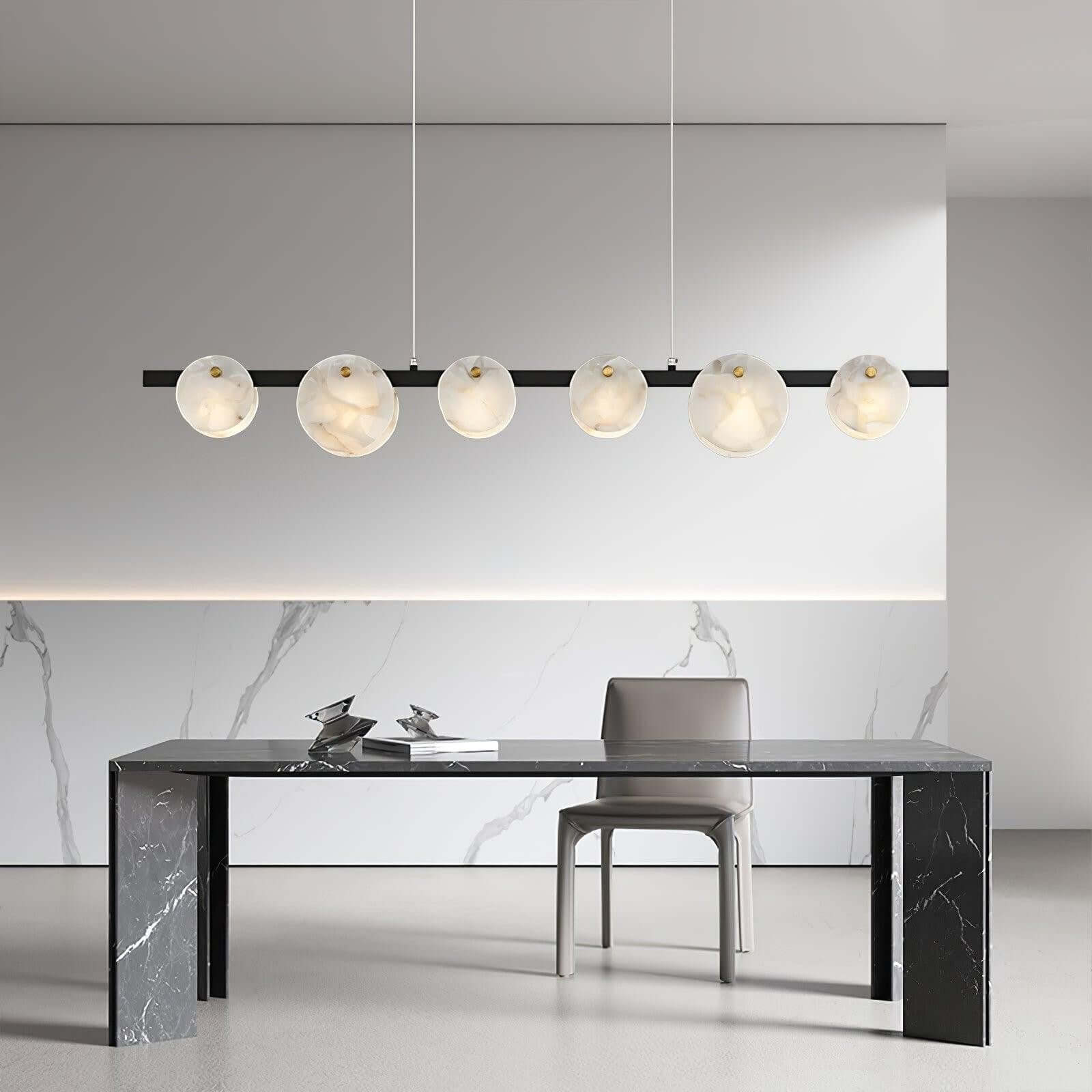Stylish Frumix 6-Light alabaster linear chandelier, enhancing mid-century modern lighting over a sleek desk.