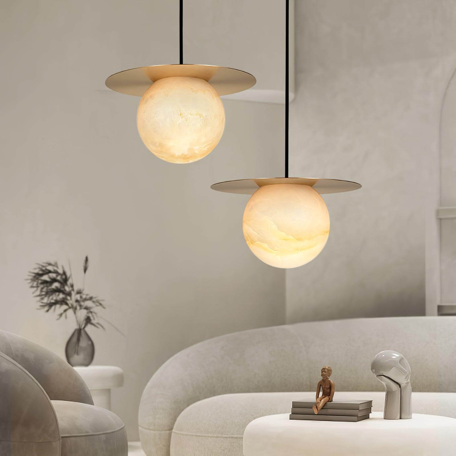 Orbix pendant lights in alabaster design, perfect for scandi and bathroom fixtures, illuminating modern living spaces.