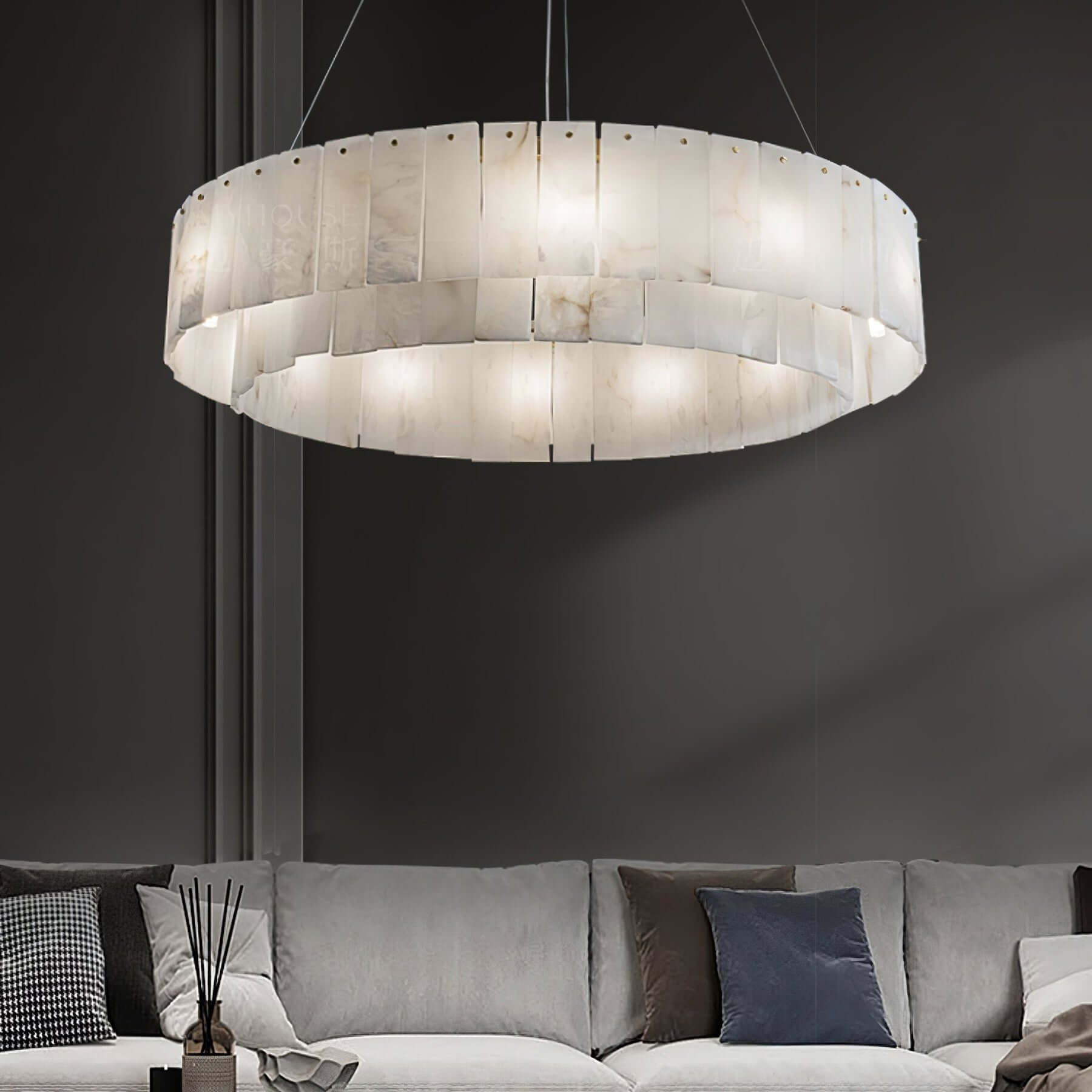 Elegant alabaster chandelier illuminating a stylish living room with modern decor, perfect for luxury interiors.