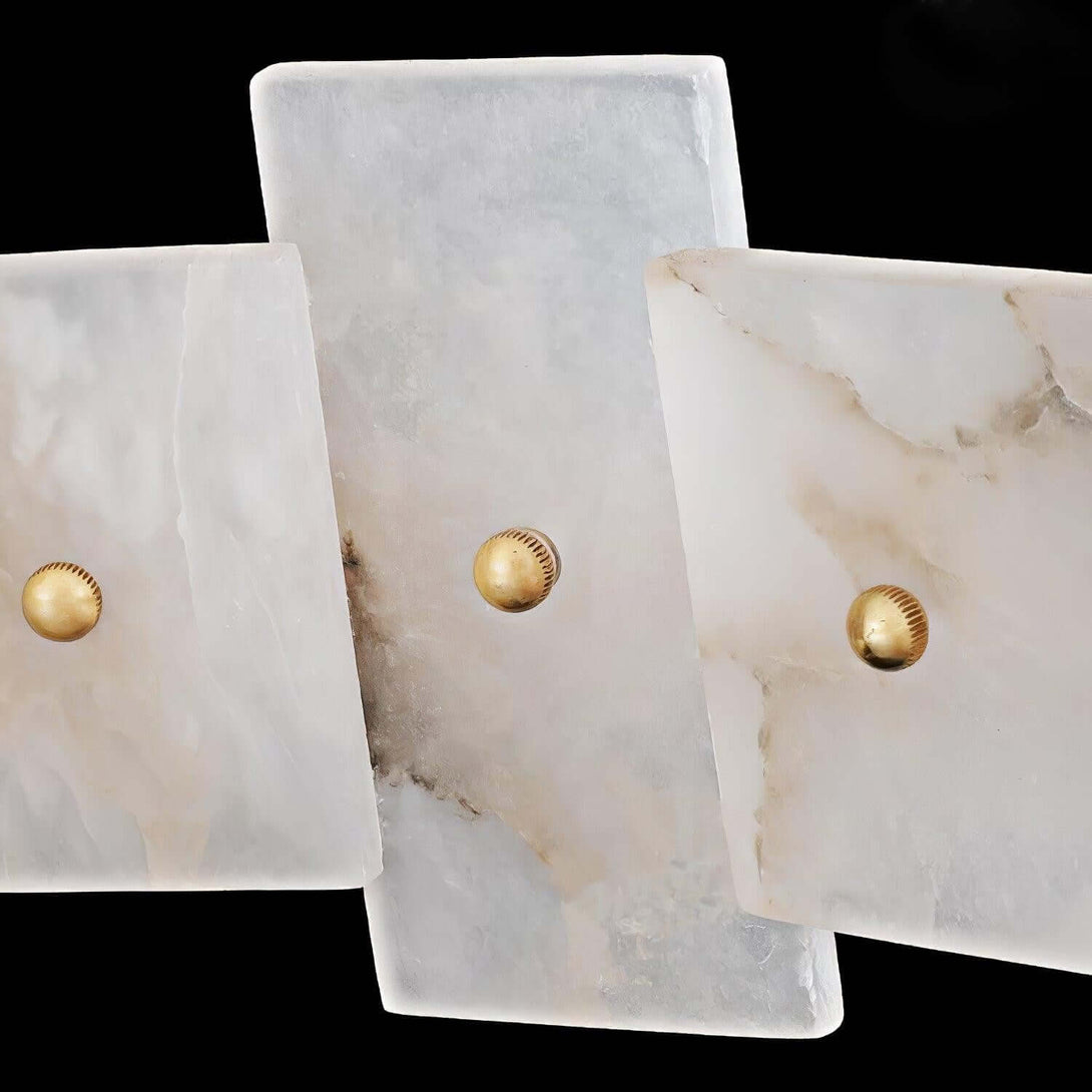 Elegant alabaster panels with brass accents, perfect for a vintage chandelier design.