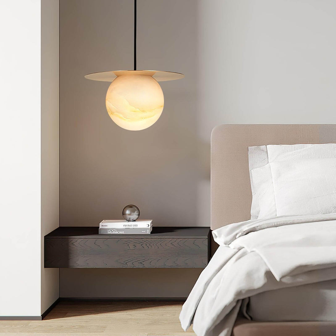 Modern alabaster Orbix pendant light in a stylish bedroom setting, showcasing Scandinavian design and elegance.