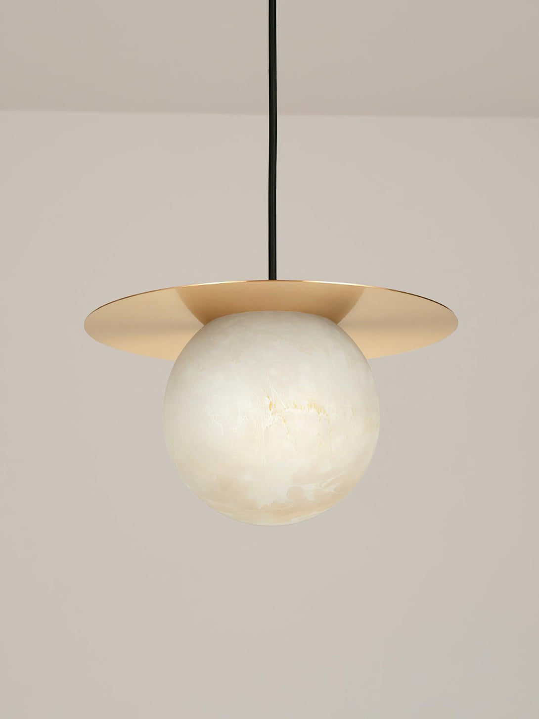 Stylish Orbix pendant light featuring a round alabaster shade, ideal for scandi interiors and bathroom fixtures.