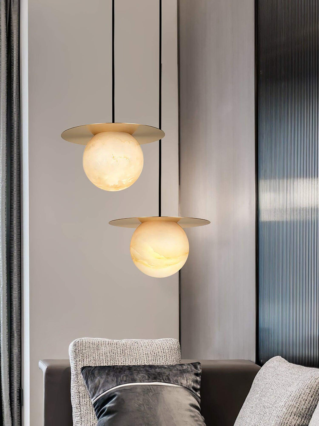 Stylish Orbix pendant lights featuring alabaster globes, ideal for scandi-style bathrooms and modern decor.