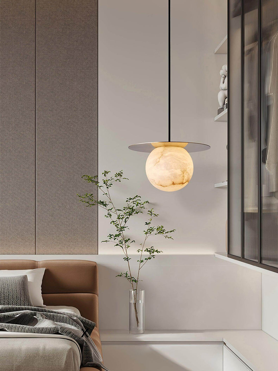 Orbix Pendant Light illuminating a modern bedroom, showcasing alabaster design and scandi style.