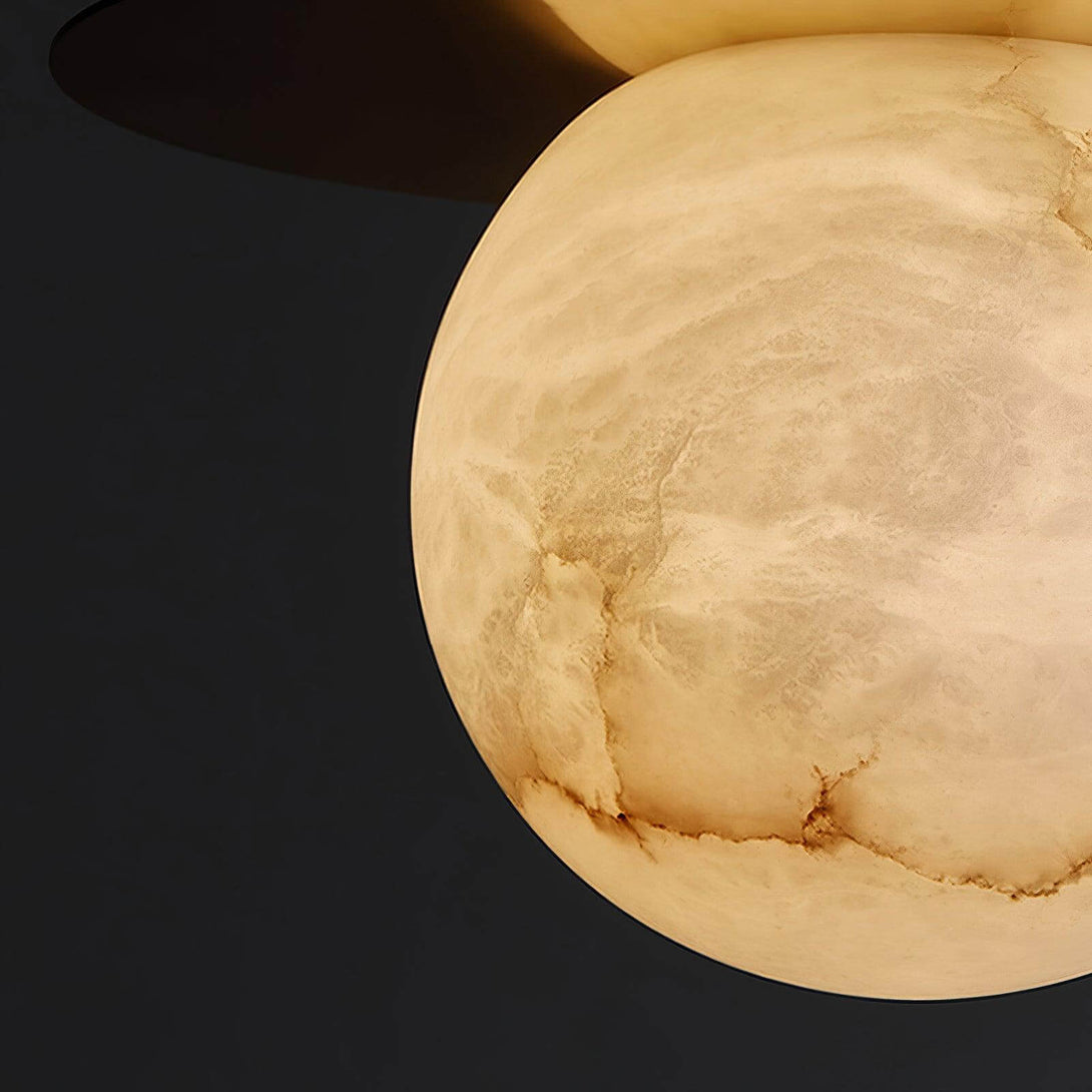 Alabaster pendant light ball on a sleek dark background, perfect for Scandi style decor.