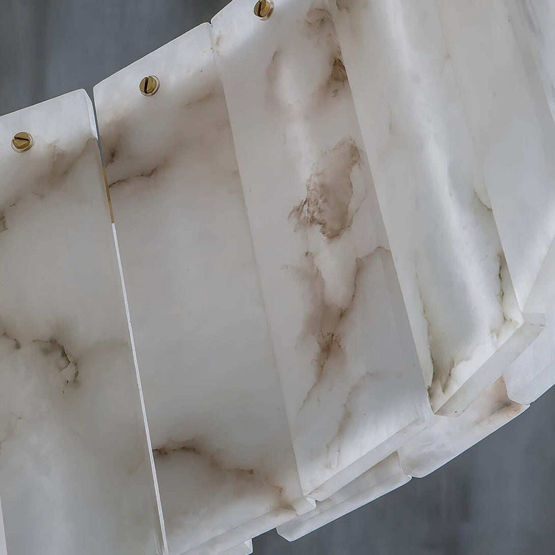 Close-up of a Solvani alabaster chandelier showcasing its elegant white and beige tones.