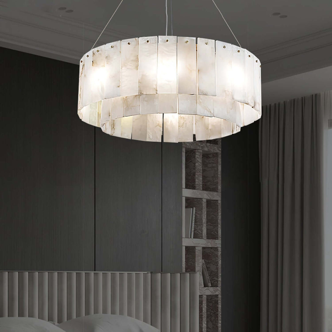Elegant alabaster chandelier in a modern bedroom, featuring a round design and soft white lighting.