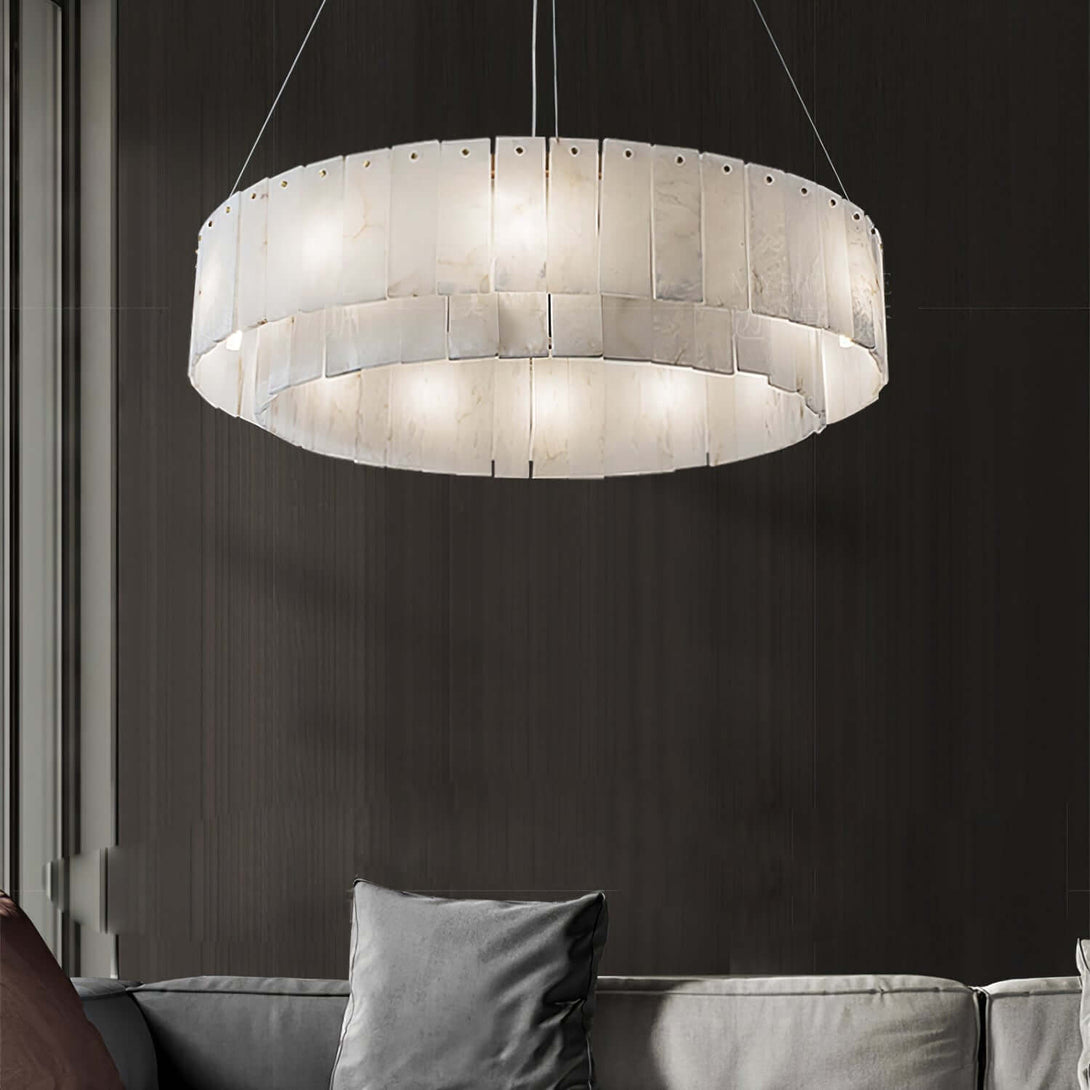 Elegant alabaster chandelier illuminating a modern living room with a sleek design.