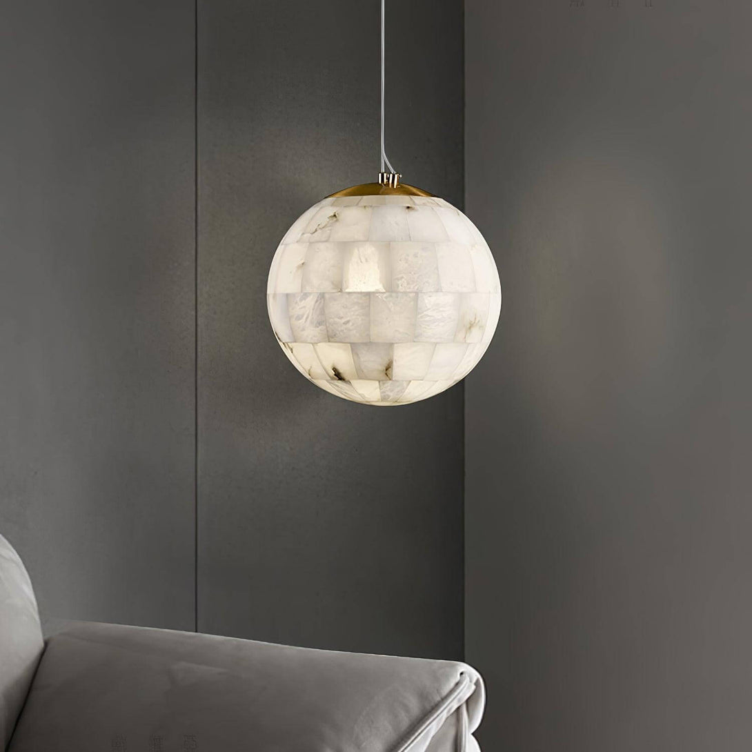 Zarqe pendant light in alabaster, spherical design perfect for kitchen pendant light fixtures, enhancing modern decor.