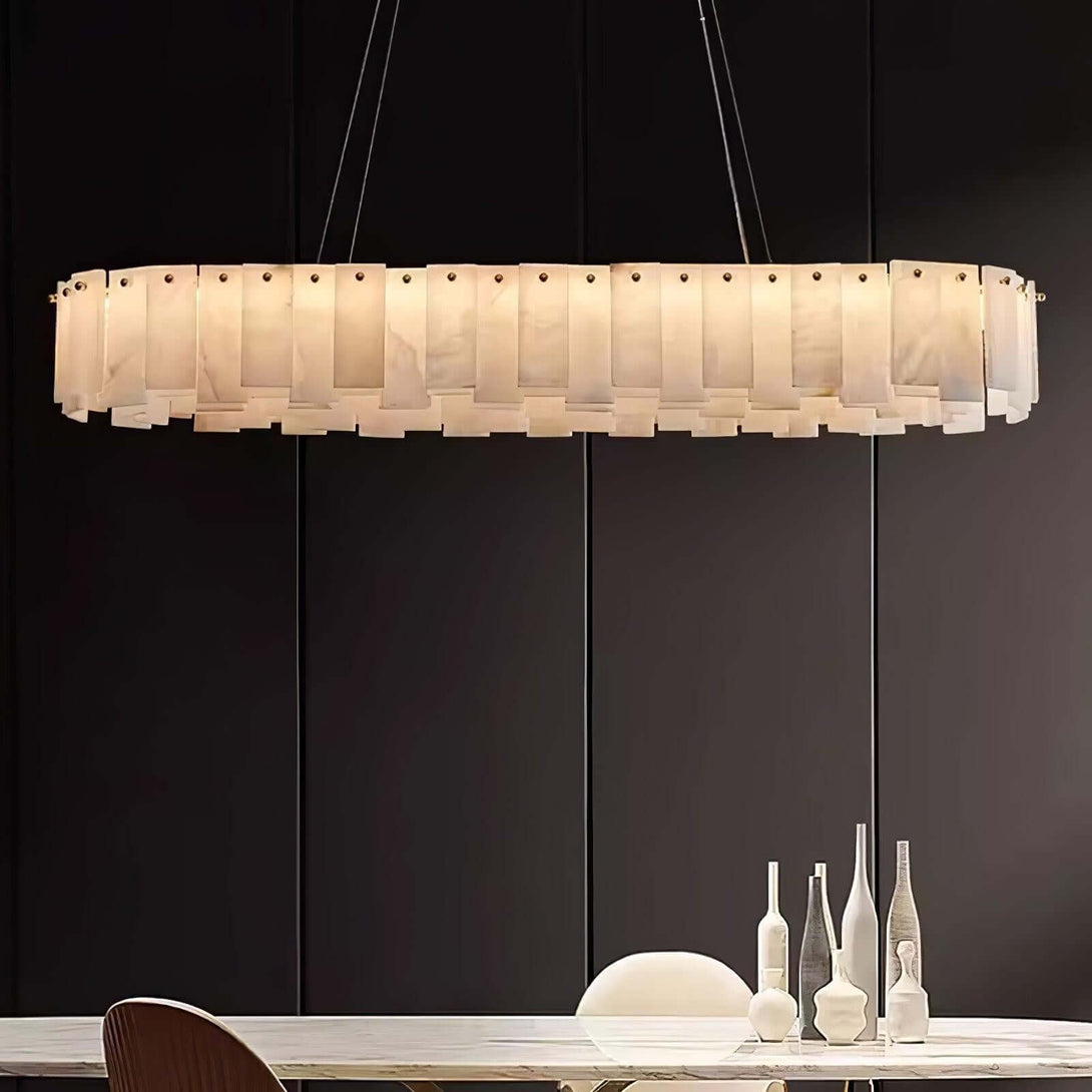 Zemora chandelier, round alabaster design, mid-century modern lighting fixture hanging over a dining table.