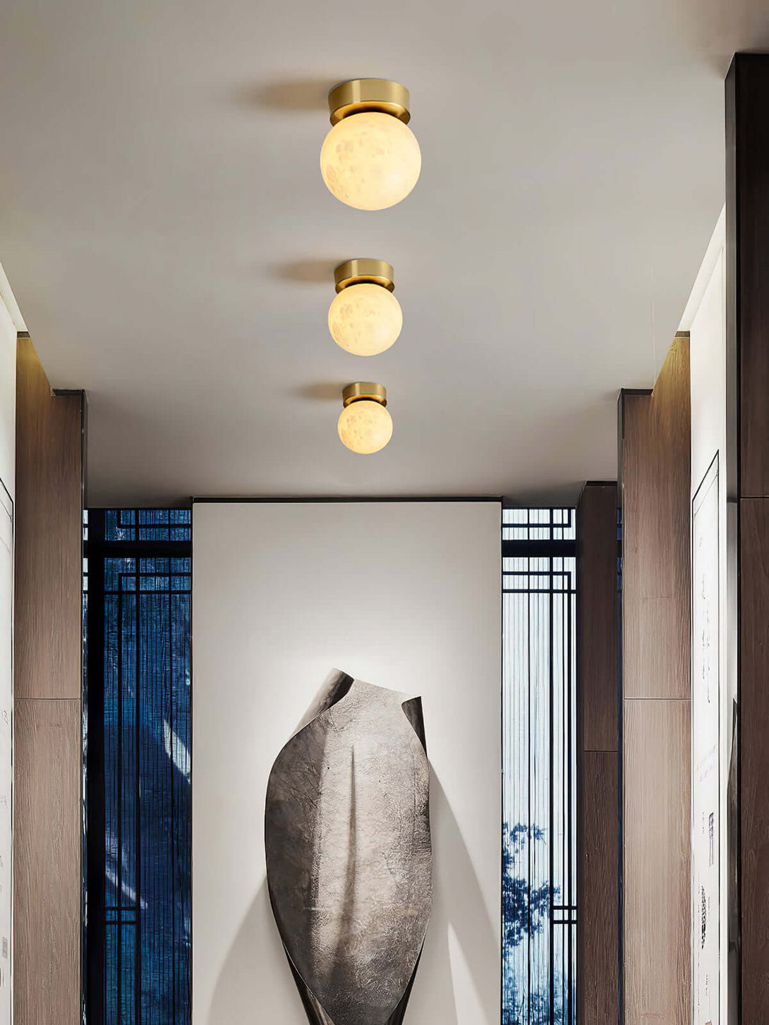 Zolume ceiling light trio in modern hallway, perfect for small bathroom lighting with art deco flair.