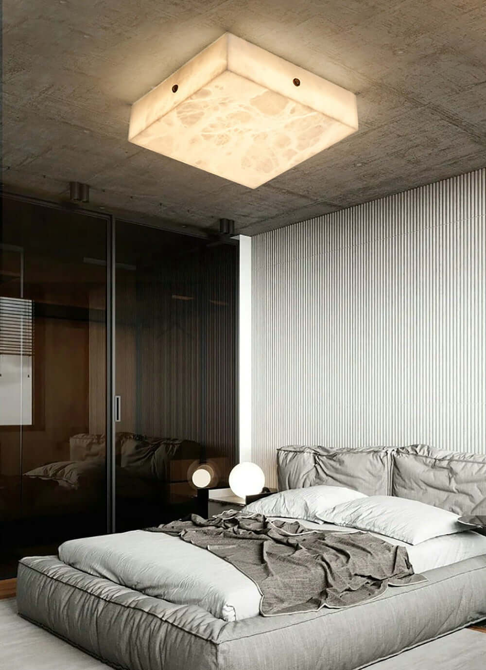 Modern alabaster flush mount ceiling light in a stylish bedroom setting, enhancing contemporary decor.