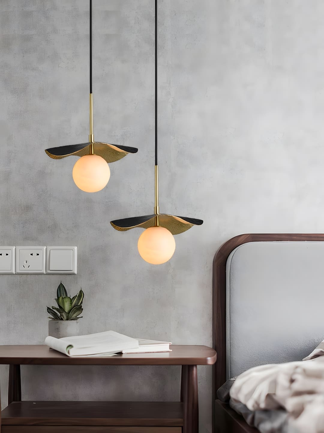 Contemporary hanging lamps for dining room, featuring brass accents and glowing globes in stylish bedroom setting.