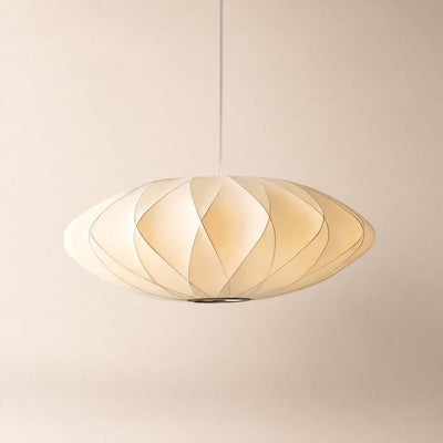 Corvya pendant light with a white silk shade, curved detailing, and a soft warm glow against a neutral background.