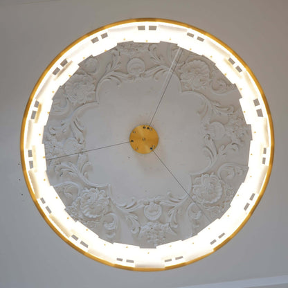 Intricate plaster ceiling design with backlit rim, showcasing a vintage aesthetic.