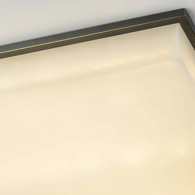 Close-up of Faylen Alabaster flush mount ceiling light showcasing sleek square design and elegant finish.