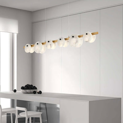 Frumix alabaster linear chandelier in a modern kitchen, showcasing mid-century design with five elegant lights.