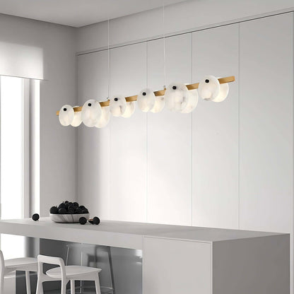 Frumix alabaster linear chandelier in a modern kitchen, showcasing mid-century design with five elegant lights.