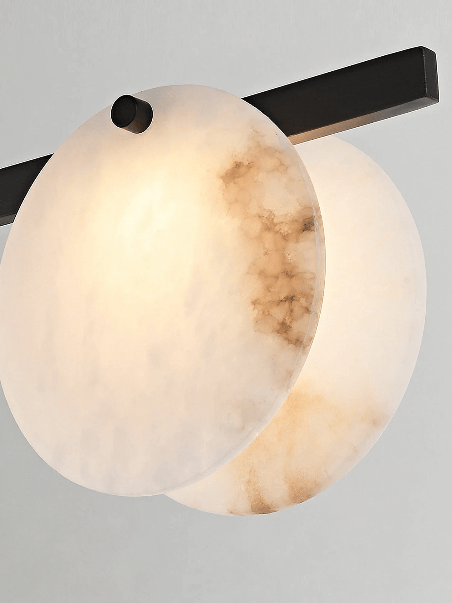 Frumix alabaster chandelier close-up showing mid century modern design and warm lighting effect.