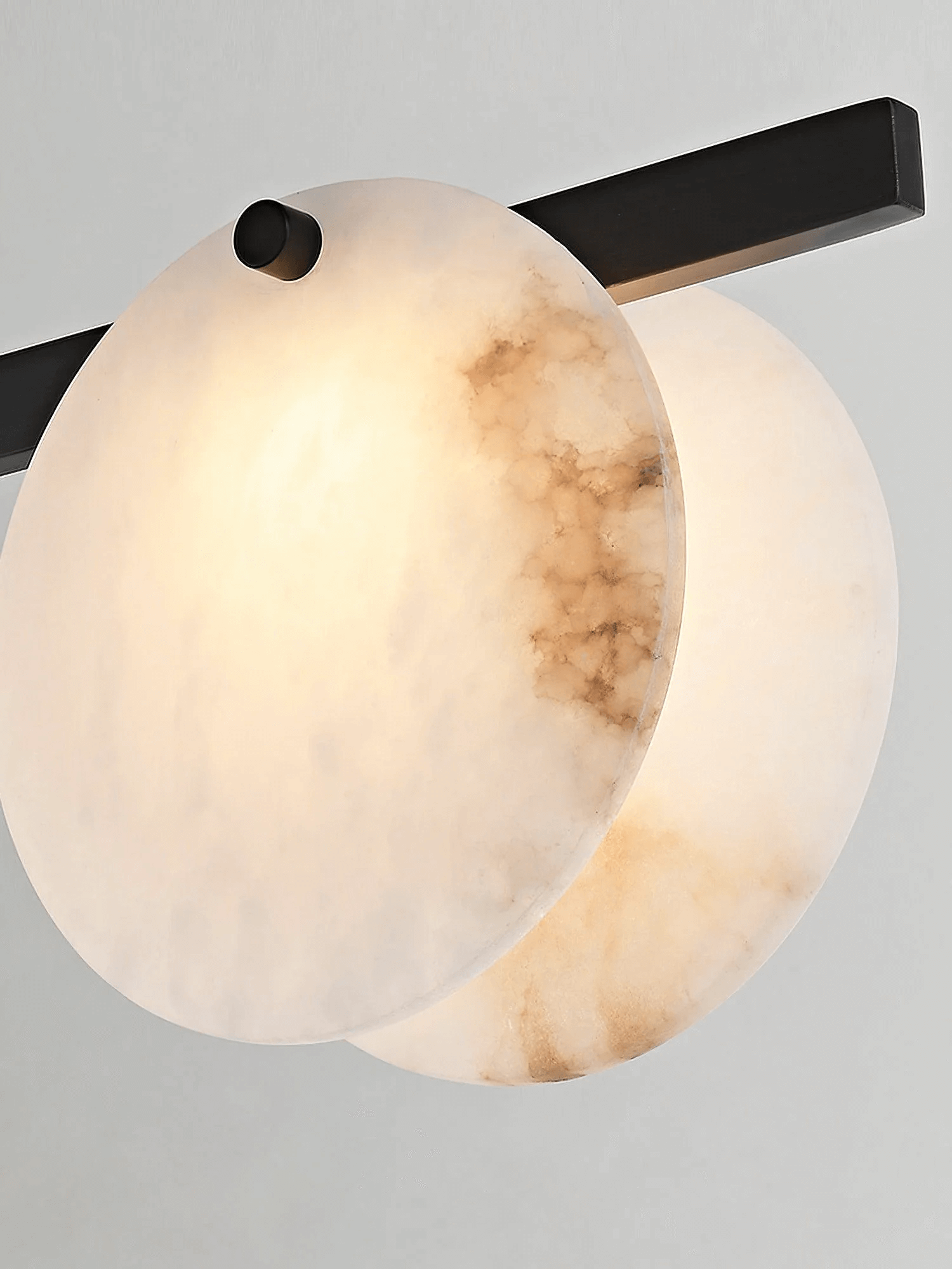 Frumix alabaster chandelier close-up showing mid century modern design and warm lighting effect.