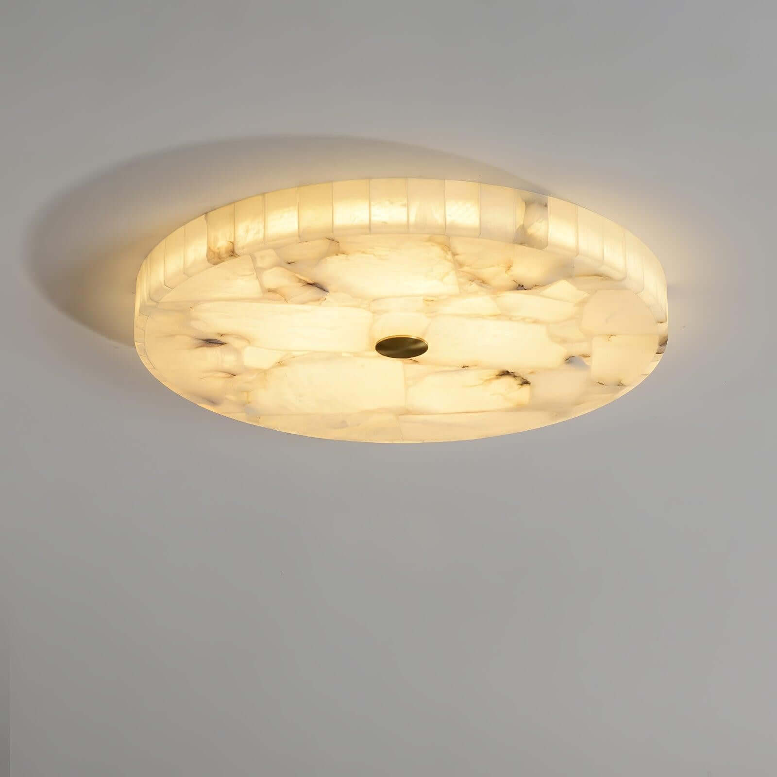 Round LED ceiling light with alabaster flush mount design, ideal for bedroom lighting.