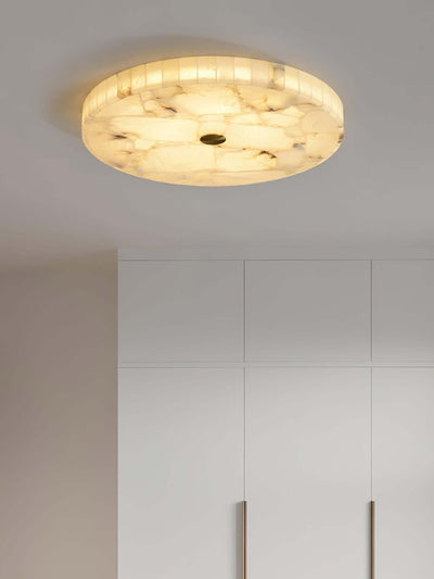 Monedra round LED ceiling light with alabaster finish, ideal for modern bedroom décor.