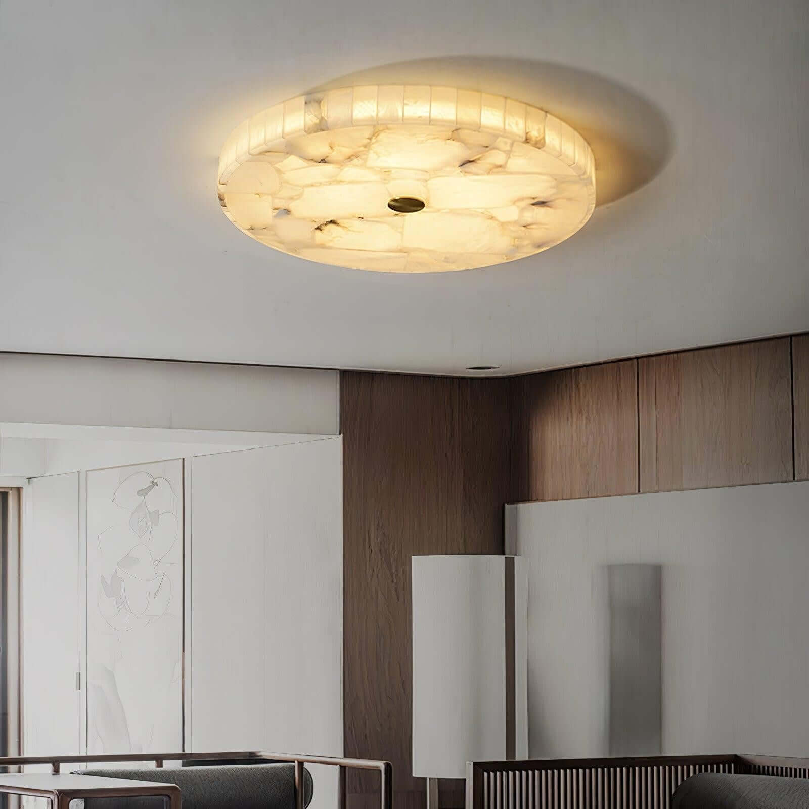 Round LED ceiling light with alabaster finish, perfect for modern bedroom decor, providing soft ambient lighting.