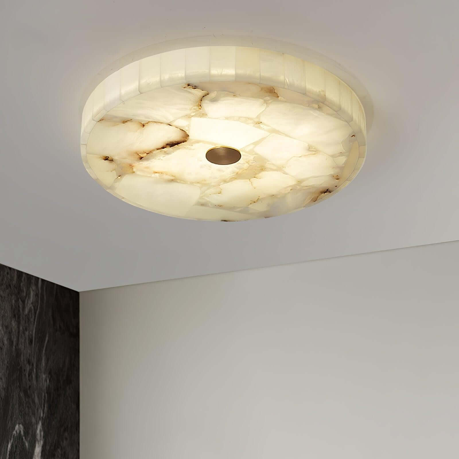 Round alabaster flush mount ceiling light, ideal for modern bedroom decor, providing stylish illumination.