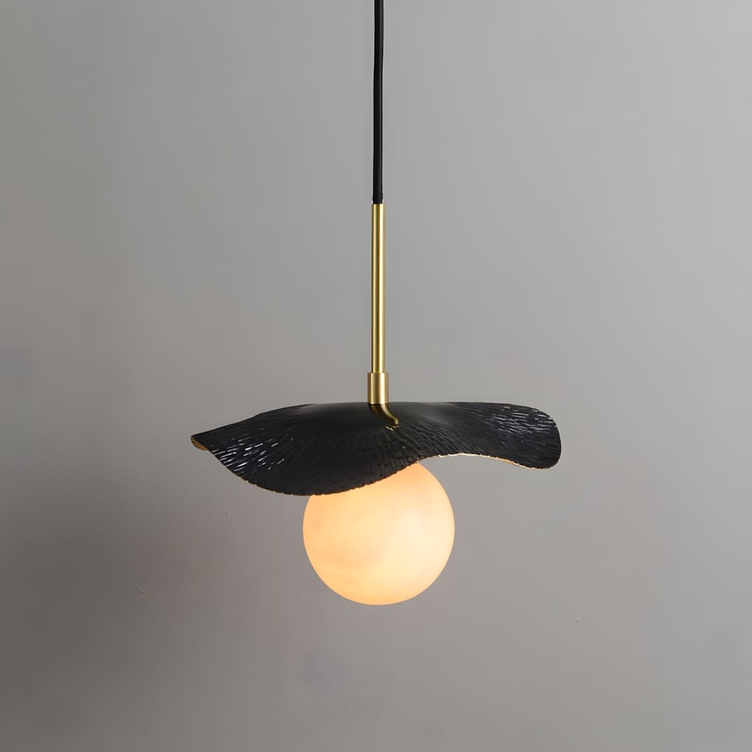Montera pendant light with black metal shade and alabaster orb, perfect for contemporary kitchen island or dining room decor.