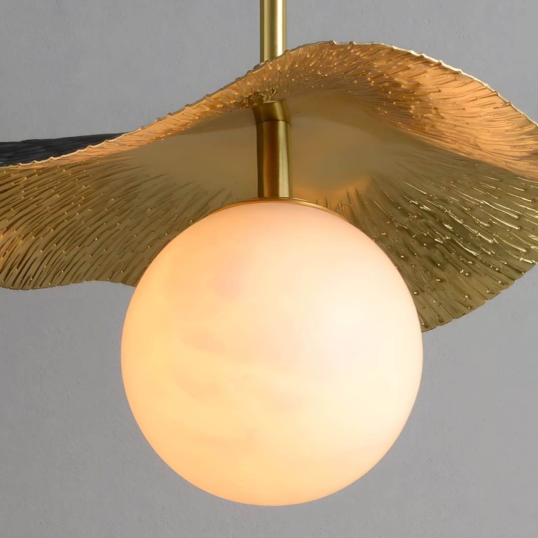 Montera pendant light featuring an alabaster globe and gold leaf design, perfect for contemporary kitchen islands and dining rooms.