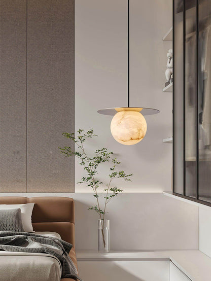 Orbix Pendant Light illuminating a modern bedroom, showcasing alabaster design and scandi style.