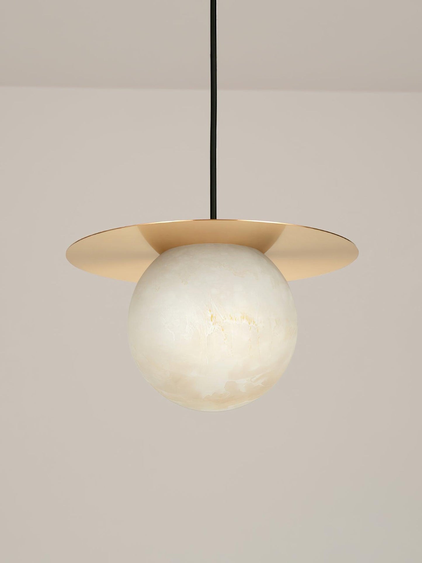 Stylish Orbix pendant light featuring a round alabaster shade, ideal for scandi interiors and bathroom fixtures.