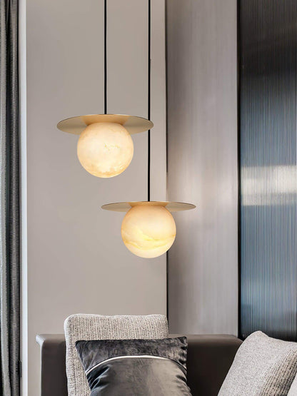 Stylish Orbix pendant lights featuring alabaster globes, ideal for scandi-style bathrooms and modern decor.