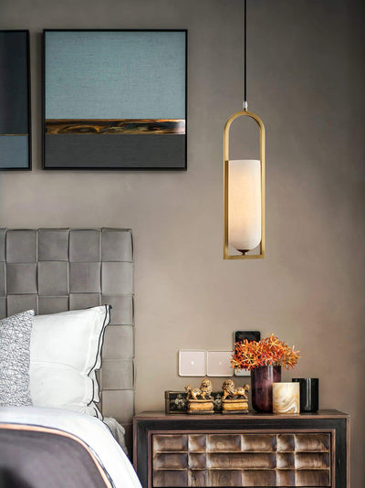 Orleni pendant light above a stylish bedside table, showcasing mid-century modern design and alabaster style.