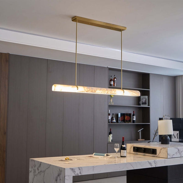 Stylish Qemir chandelier in modern dining room, featuring alabaster and gold finish, perfect light fixture.
