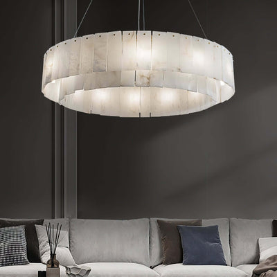 Elegant alabaster chandelier illuminating a stylish living room with modern decor, perfect for luxury interiors.