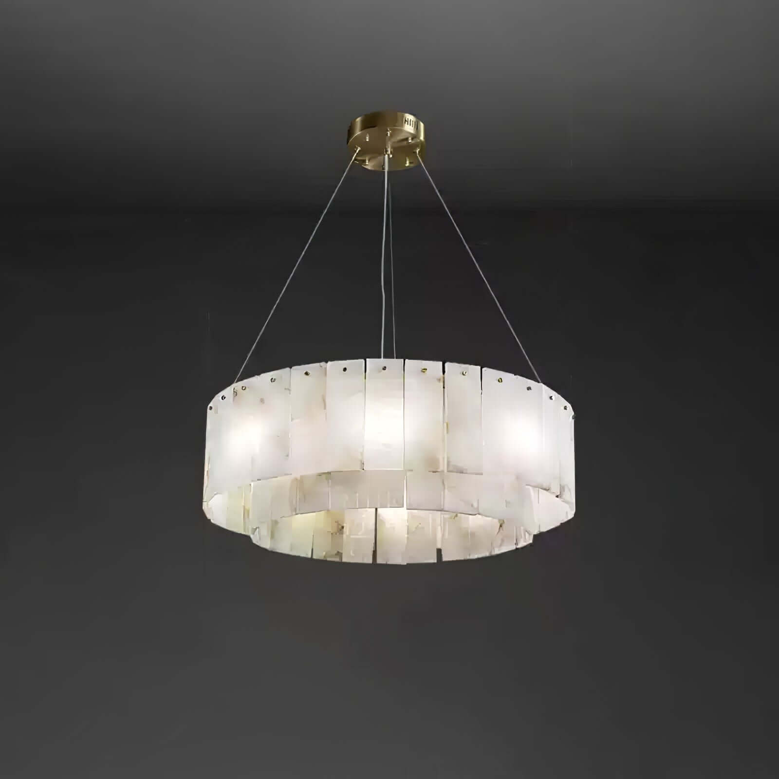 Solvani alabaster chandelier with a modern design, featuring two tiers and a sleek gold finish.