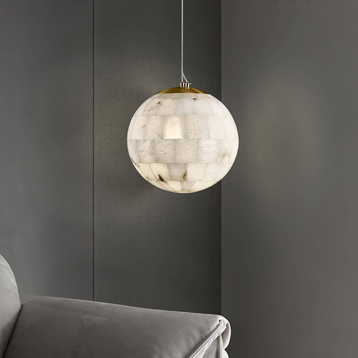 Zarqe pendant light in alabaster, spherical design perfect for kitchen pendant light fixtures, enhancing modern decor.