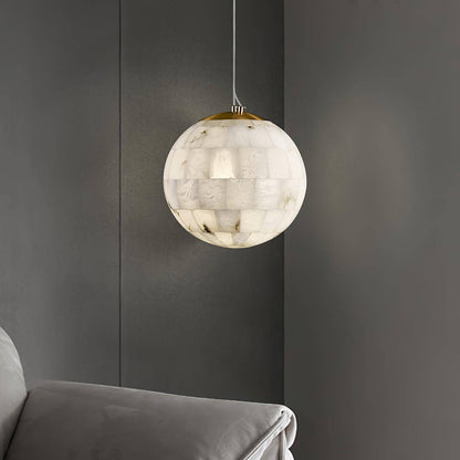 Zarqe pendant light in alabaster, spherical design perfect for kitchen pendant light fixtures, enhancing modern decor.