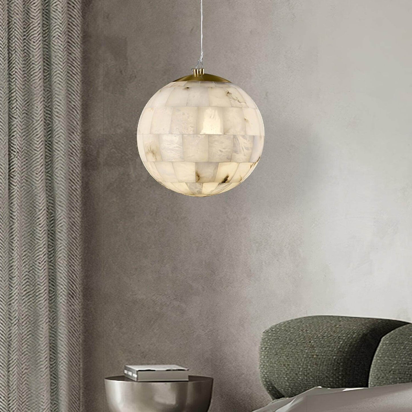 Zarqe pendant light featuring alabaster design, spherical shape, perfect for kitchen pendant light fixtures.