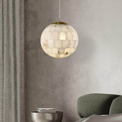 Zarqe pendant light featuring alabaster design, spherical shape, perfect for kitchen pendant light fixtures.