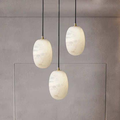 Zelino pendant light trio in alabaster, perfect for kitchen island lighting with MCM style.