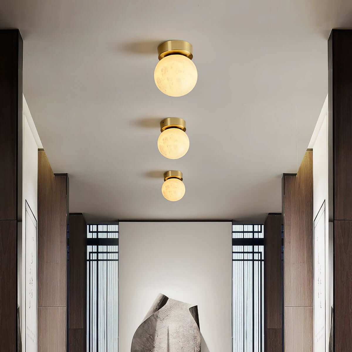 Zolume ceiling light in a modern hallway, featuring art deco design and alabaster semi-flush finish, ideal for small spaces.