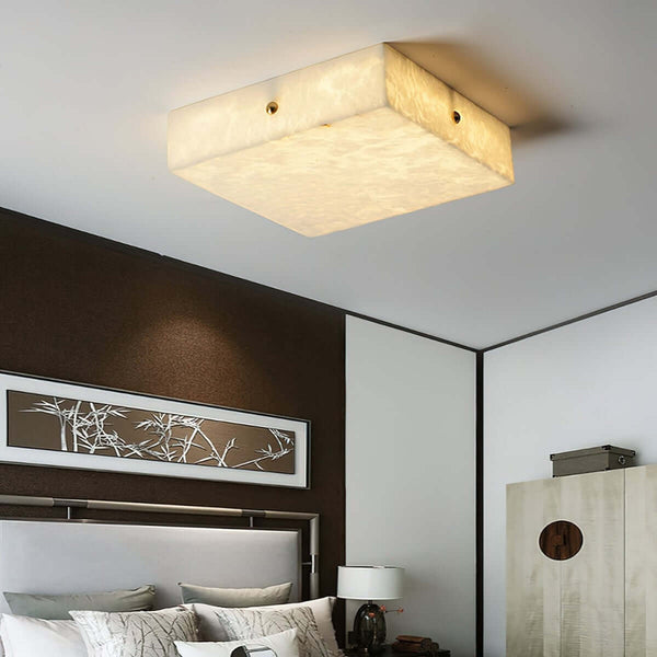 Zymero ceiling light in a modern bedroom, featuring an alabaster flush mount design and square shape.